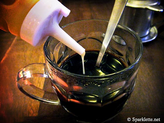 Adding condensed milk to Vietnamese drip coffee