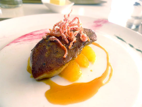 Pan seared foie gras with fresh orange segments, orange and passion fruit reduction