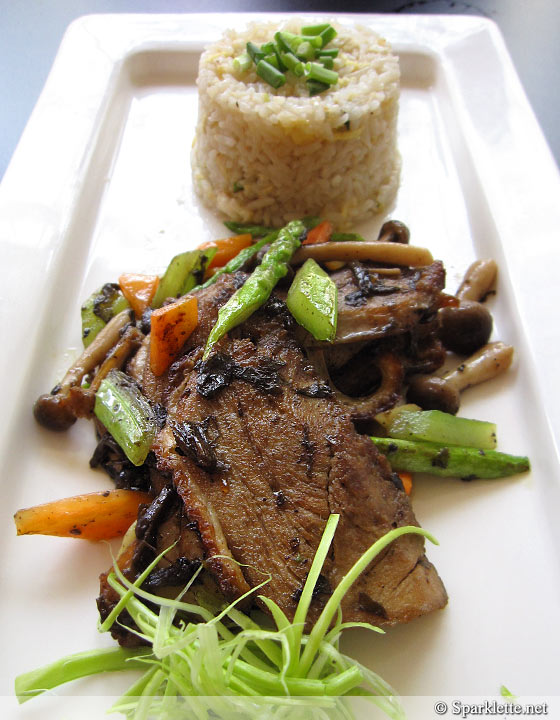 Wok-fried duck breast with olive vegetable, garlic fried rice and sauteed asparagus