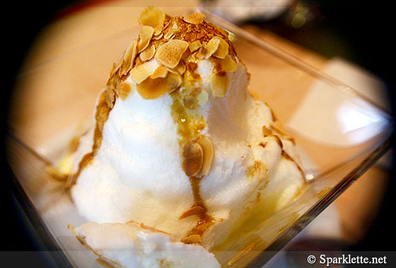 Soufflé with vanilla custard, almonds and caramel sauce