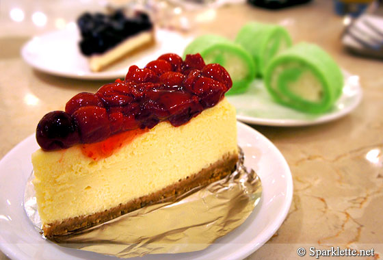 New York cheesecake with red cherries