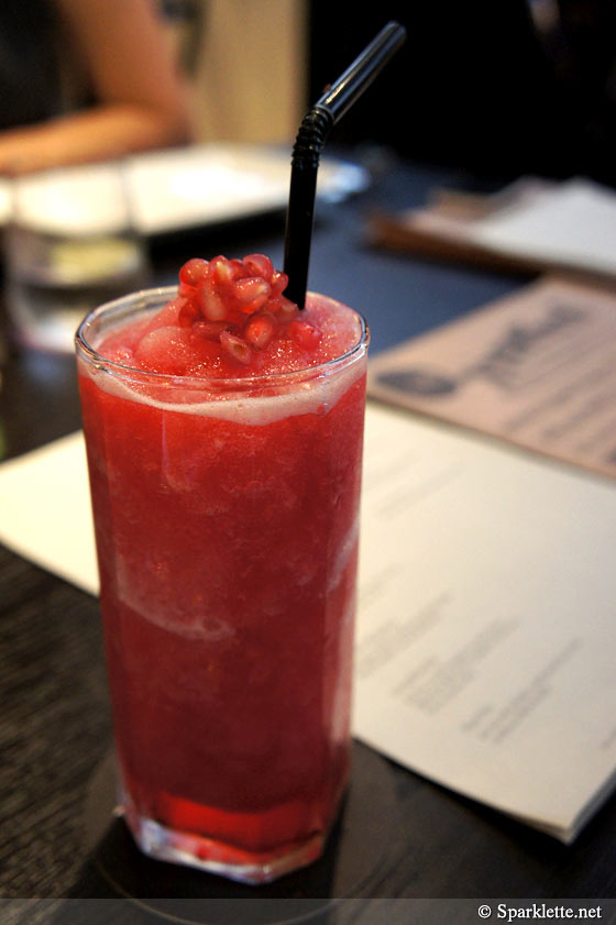 Red mocktail of fresh mint leaves, pomegranate, lime and lychee juice