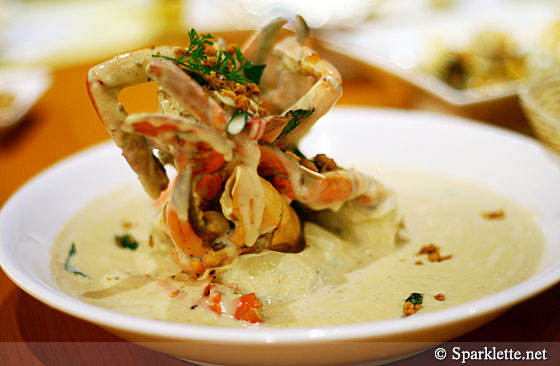 Creamy butter crab topped with coconut crumbs