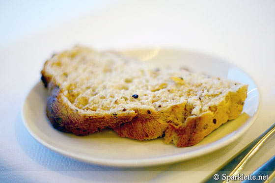 Warm rustic breads with olives, radishes and French butter