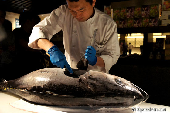 Chef Shigeru slicing up yellowtail tuna, Triple Three at Mandarin Orchard Singapore