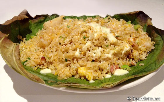Baked fried rice with seafood served on lotus leaf