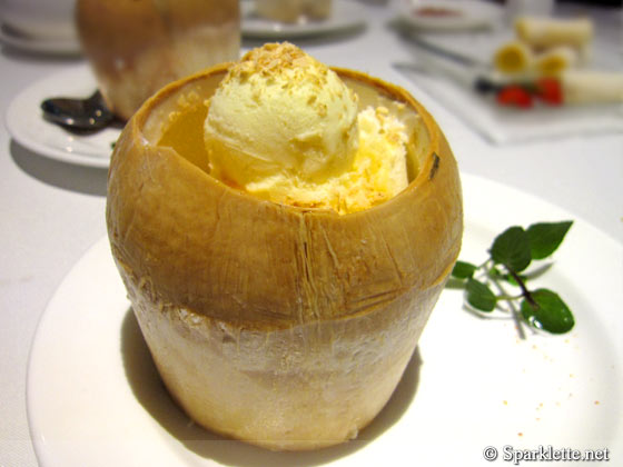 Chilled mango cream with pomelo, diced mango and sago served with ice cream in young coconut