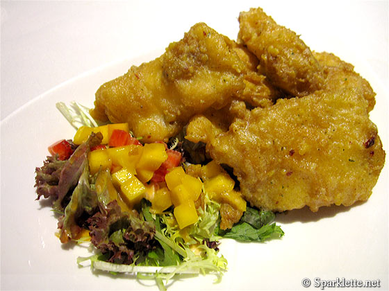 Deep-fried cod fillet coated with salted egg yolk served with organic vegetables