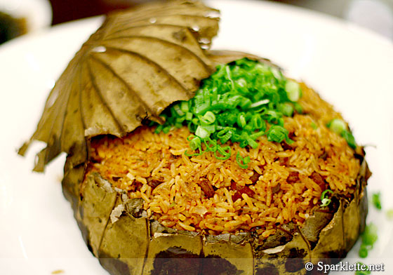 Fried rice with Chinese sausage, fish roe and diced mushrooms in lotus leaf