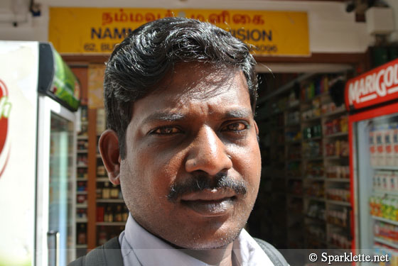 Man at Little India (captured on Nikon 1 J1 compact camera)