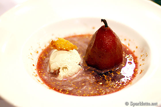 Poached pear in red wine with vanilla ice cream