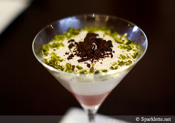 Martini of strawberry coulis, ricotta and banana cream topped with bitter chocolate chips 70%
