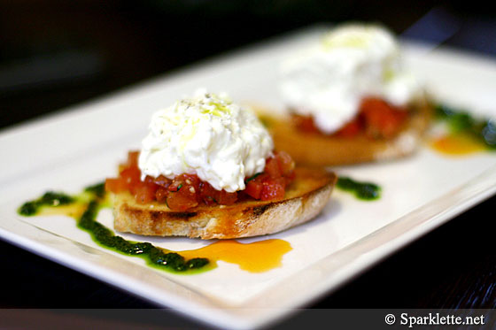 Toasted home-made Tuscan country bread brushed with garlic, topped with crushed tomato and creamy burrata, finished with basil oil and a pinch of sea salt