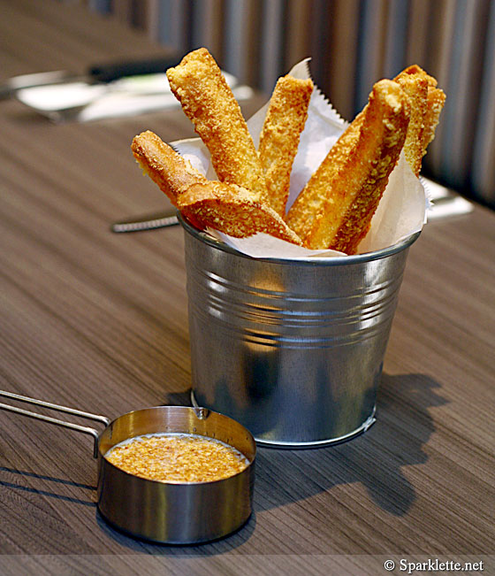 Golden dip with cheesy bread stick