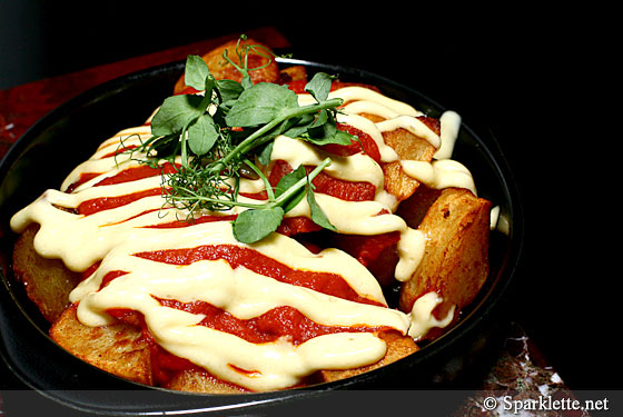 Fried potato (patatas bravas), spicy sauce and garlic aioli