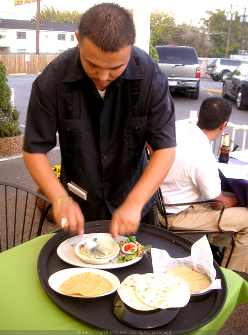 Waiter preparing our food