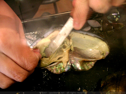 Pearl being harvested from an oyster