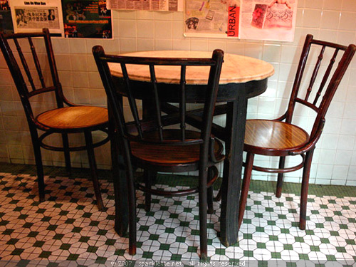Old dining chairs and table at The Singapore Heritage Restaurant