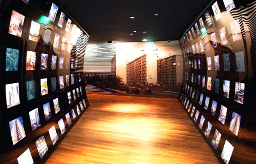 Passageway with television screens lining both sides
