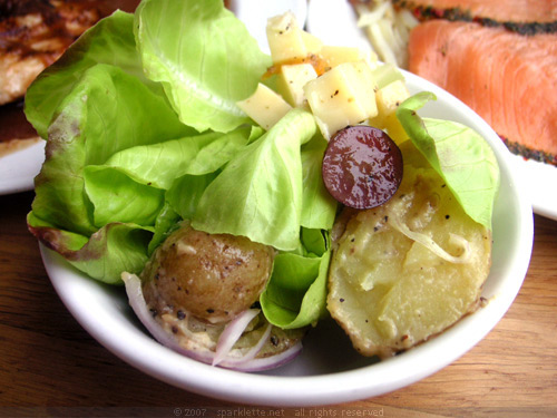 Small salad with lettuce, cheese and baby potato
