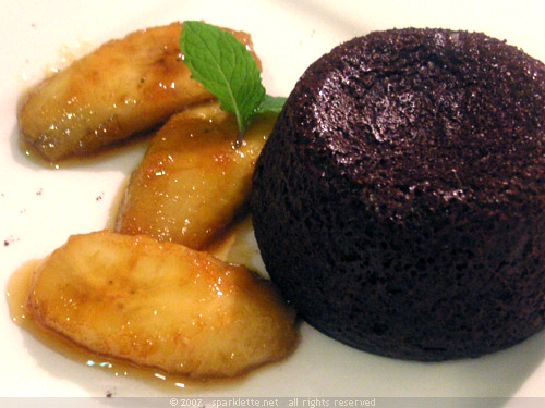 Dark lava chocolate gateau with flambé banana