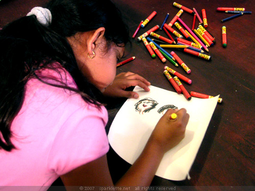 Little girl drawing a picture