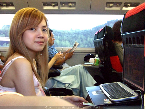 Me using my laptop on board the train heading towards Shinjuku
