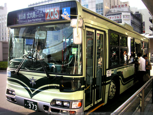 Passengers boarding a public bus in Kyoto