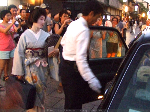 Geisha getting into cab at Gion in Kyoto
