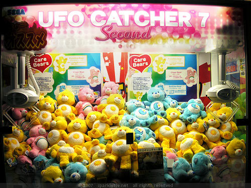 Claw vending machine with Care Bear plush toys