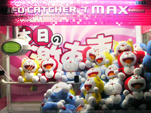 Claw vending machine with Doraemon plush toys