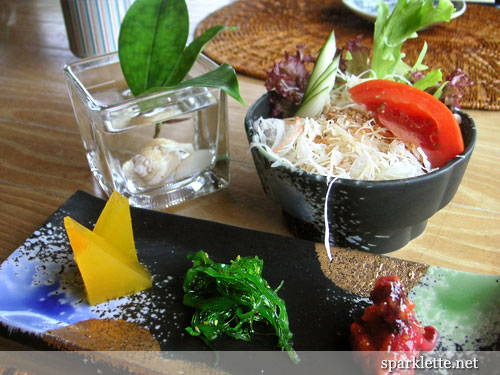 Salad and appetiser of baby octopus and seaweed