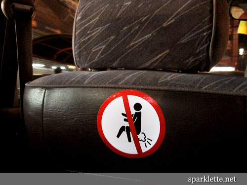 No farting sign on taxi