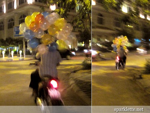 Motorcyclist with colourful balloons in Siem Reap