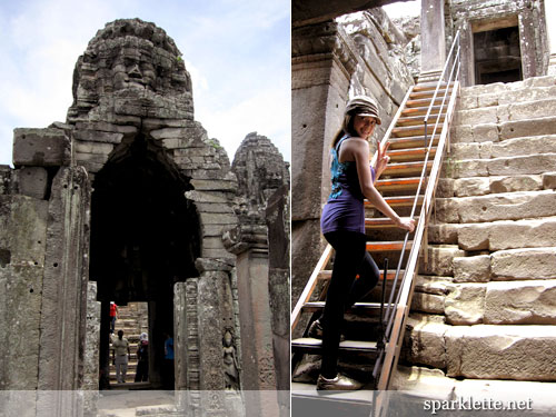 Climbing to the top of the Bayon in Angkor Thom, Cambodia