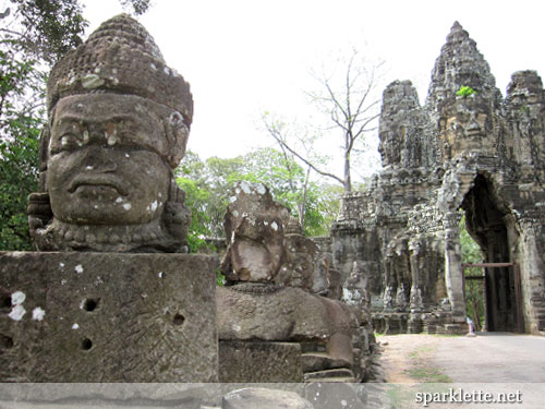 Statues leading up to city gate of Angkor Thom, Cambodia