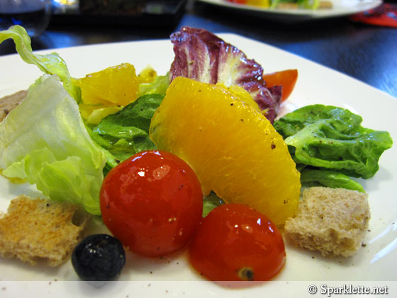Orange, blueberries, mixed greens, cherry tomato, multi grain bread salad