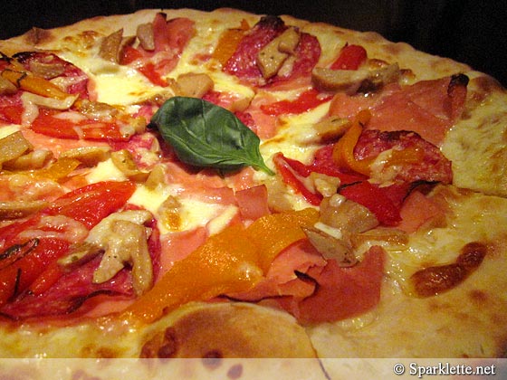 Pizza with mozzarella, ham, capsicum, Porcini and Parmesan cheese